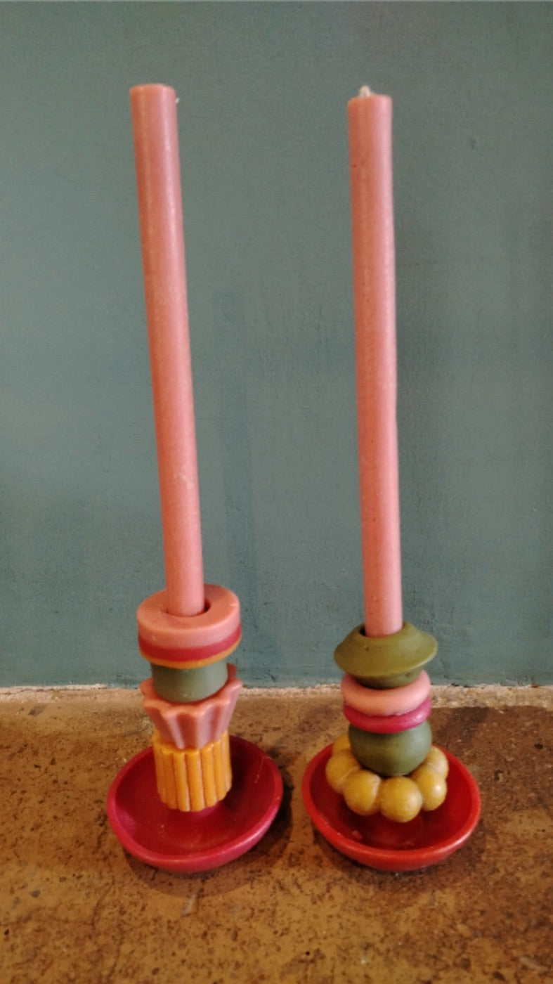 Matching pink candle pair with different stackable pieces