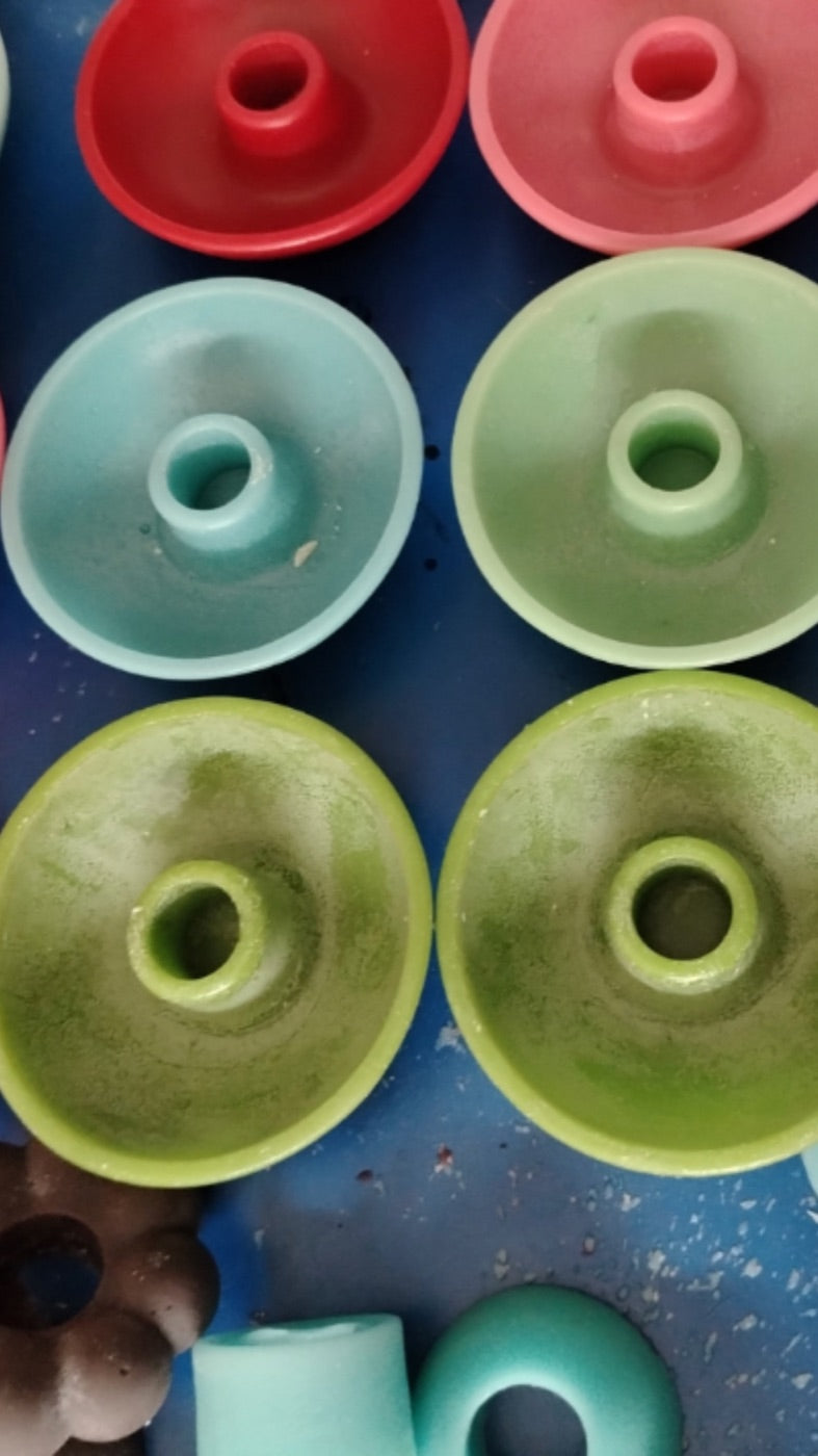 Wax candle holders in various colors